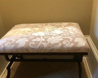 Small beige upholstered bench is perfect for a vanity or extra seating. 
