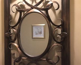 Lovely  metal mirror accents to a quiet corner. 