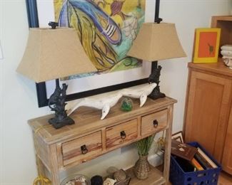 carved whales, nautical artwork, cute rustic console table