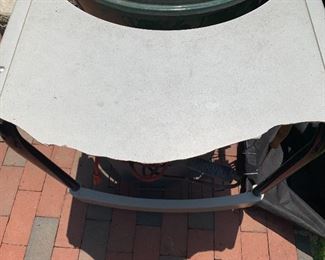 the edge of the grill's table has broken off