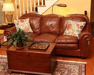 Soflex leather sofa and a fine, dovetailed chest by Hooker Furniture.