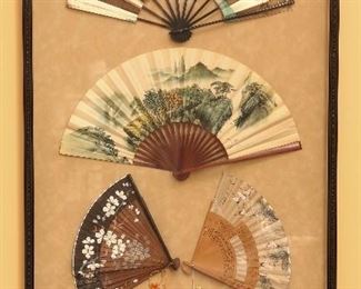 Framed group of old oriental fans.