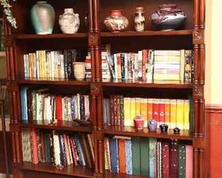 Large, handsome bookcase with fine details and lots of books.