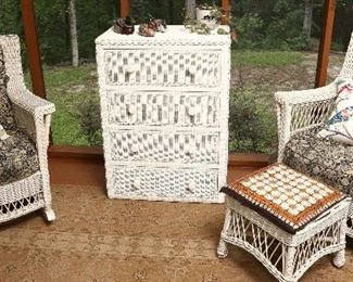 View of porch with wicker furniture.