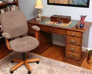 Desk with rolling chair.