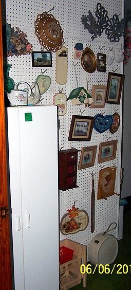 White storage cabinet, pictures and frames, etc...