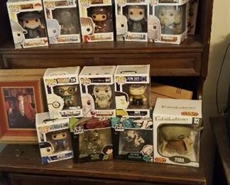 and the third bookcase. Many Pops including Star Wars