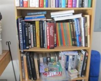 Four bookcases full of books, tapes, CDs
