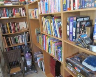 Four shelves of books, etc.