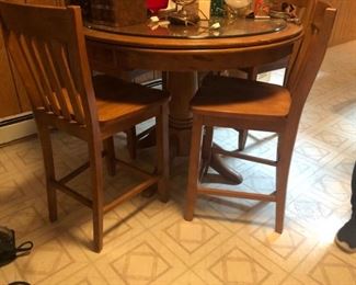 pub height table and four stools chairs