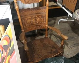 antique highly carved rocking chair