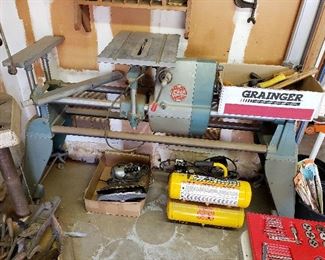 Vintage Shopsmith workshop lathe, table saw and other attachments.