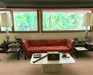 Mid Century Modern Drop Arm Sofa (Dunbar by Edward Wormley) with Hinged Arms (Jack Lenor Larsen Fabric), MCM End Tables with Atomic Motif (The Tilers), Marbro Lamps, and Travertine Coffee Table