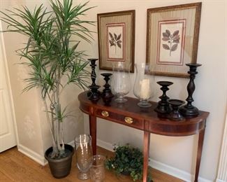 Set of 4 botanical framed prints, black pottery barn candlesticks, clear glass pottery barn hurricanes, Sherrill demilune