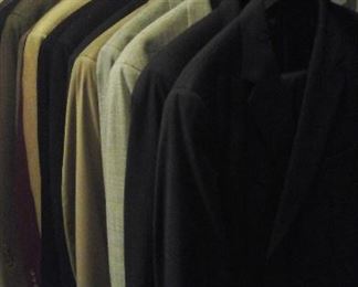 Mens  suits, sport jackets and one tuxedo. 