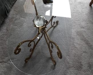 Gold metal base and glass oval top.  Coffee table