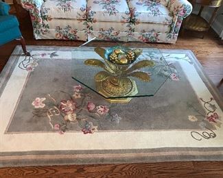 Rug and glass coffee table 