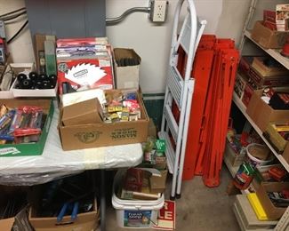 tons of saw blades & 11 metal portable horses