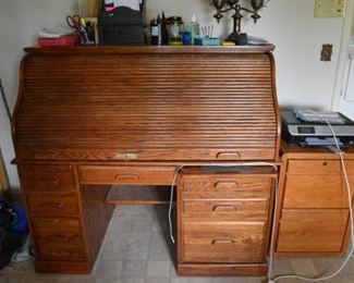 Oak roll top computer desk with hidden tower and power supply.