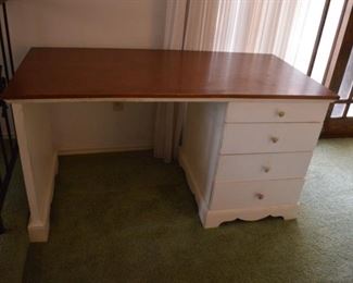 Super sturdy wood kids desk. We've had this for over 20 years and it will definitely take anything you throw at it. 