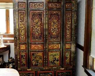 Intricately carved and painted Chinese cupboard