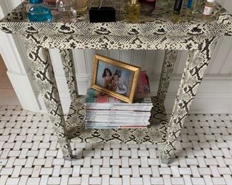126. Faux Snakeskin Side Table on Casters (19'' x 12'' x 24'')