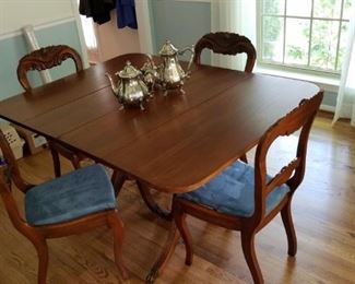 antique drop-leaf dining table with 4 upholstered chairs