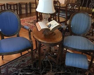 Recovered antique chairs, table, and crystal lamp.