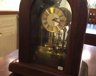 Wood encased anniversary clock.
