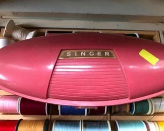 this is one of those hand-held sewing machines for sewing hems while you've still got on the dress and such