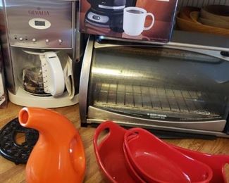 Never used Gevalia Coffee Maker, Black and Decker Toaster Oven, and other Enameled cookware plus a Mr. Coffee.