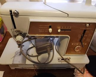 Portable Singer Sewing Machine with all the Attachments