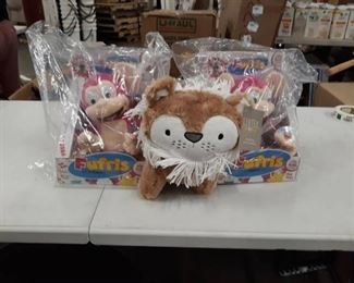 Two Pink Fufris and a Lion Plush