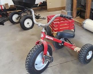 Tricycle with chunky tires and cart. 