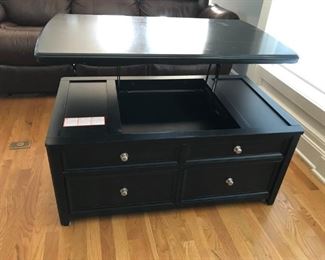 Signature design Lift-Top Cocktail table with 3 storage drawers