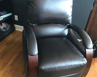 Dark brown leather,contemporary recliner with mahogany trim arms