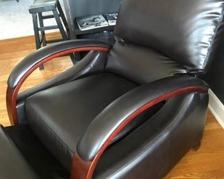 Dark brown leather,contemporary recliner with mahogany trim arms