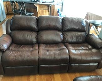 Distressed brown leather reclining couch