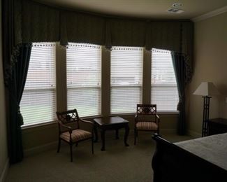 Drapes and Wooden Table. Chairs with Modern Metal Lamp. 