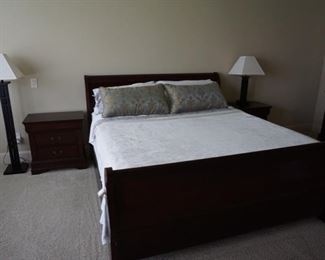 Master Bedroom Furniture. Queen Sized Bed. Modern Lamps and Wooden Night Stands.