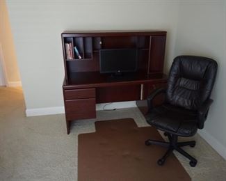 Rolling Chair and Wooden Desk.