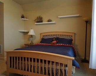 Queen Sized Bed. Metal Lamps. Wooden Boats. Nightstand.