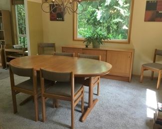 Rosengaarden Dining Table with 2 Hidden leaves and 6 chairs. Table measures approx 65 in. L x 39 in W x 29 in H without the leaves - as shown above.