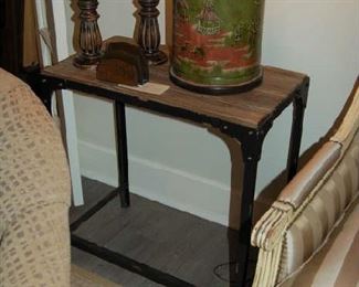 One of several inlaid wood and metal side tables