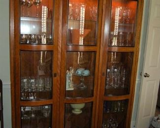 Curved front lighted china cabinet