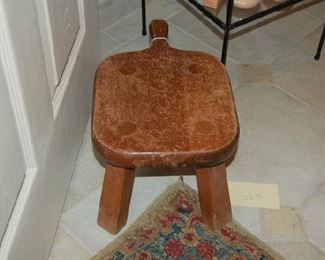 One of several antique milking stools