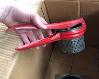 Beautiful red-handled potato ricer