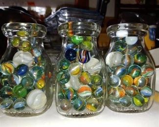 Vintage marbles in vintage half pint milk jars