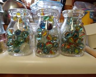 Vintage marbles in half pint milk bottles