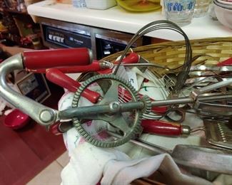Great collection of wooden handle kitchen utensils some are Bakelite red